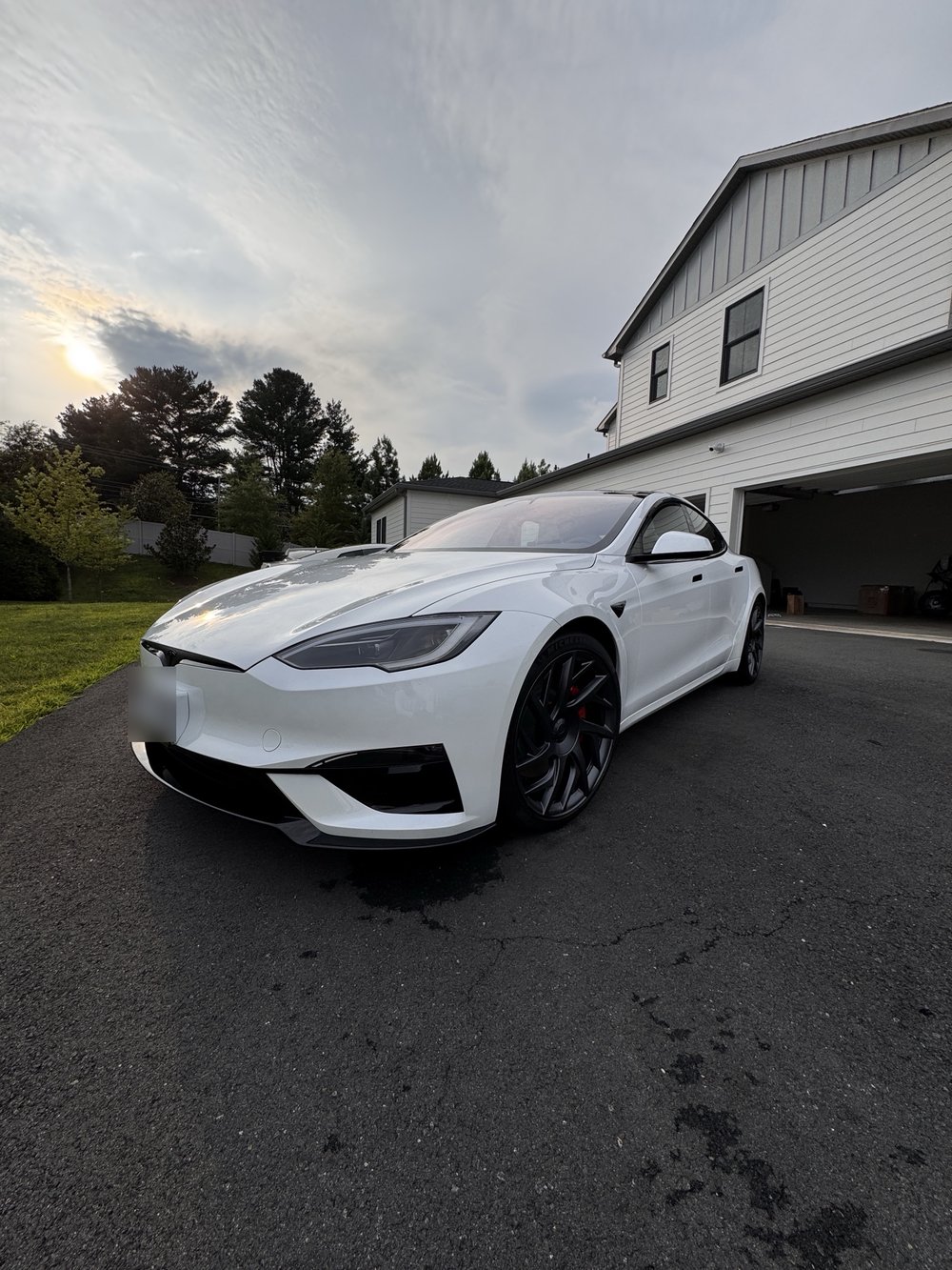 White Tesla Model S Plaid with black wheels after a full detail