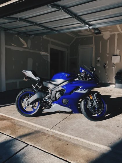 Blue Yamaha R6 motorcycle detailed in a garage